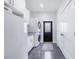 Bright laundry room with washer, dryer, and ample cabinet space at 12510 Lake Hatchineha Rd, Haines City, FL 33844
