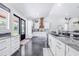 Spacious kitchen with granite countertops, modern appliances, and a farmhouse sink at 12510 Lake Hatchineha Rd, Haines City, FL 33844