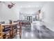 Kitchen with island, white cabinets, and dining area with round table and chairs at 12510 Lake Hatchineha Rd, Haines City, FL 33844
