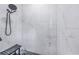 Large walk-in shower with marble-style tile and a built-in seat at 12510 Lake Hatchineha Rd, Haines City, FL 33844