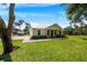 Modern farmhouse with large front yard and covered porch at 12510 Lake Hatchineha Rd, Haines City, FL 33844
