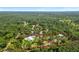 Aerial view of a house and barn on a large lot at 12510 Lake Hatchineha Rd, Haines City, FL 33844