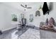 Multi-purpose room with concrete floors, a gun safe, and large windows at 12510 Lake Hatchineha Rd, Haines City, FL 33844