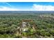 Aerial view of property with home and carport at 12510 Lake Hatchineha Rd, Haines City, FL 33844