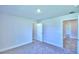 Well-lit bedroom with carpet flooring and access to other rooms at 2123 Cartgate Lane, Winter Haven, FL 33884