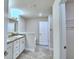 Bright bathroom with double vanity, soaking tub, and tile flooring at 2123 Cartgate Lane, Winter Haven, FL 33884