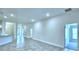 Open living area with tile floors and access to other rooms at 2123 Cartgate Lane, Winter Haven, FL 33884