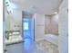 Double vanity bathroom with granite countertop and tile flooring at 2123 Cartgate Lane, Winter Haven, FL 33884