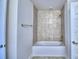 Bathroom with tub and shower combination and tile surround at 2123 Cartgate Lane, Winter Haven, FL 33884