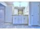Double vanity bathroom with granite countertop and tile flooring at 2123 Cartgate Lane, Winter Haven, FL 33884