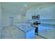 Modern kitchen with stainless steel appliances and island at 2123 Cartgate Lane, Winter Haven, FL 33884