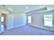 Spacious bedroom with carpet flooring and two large windows at 2123 Cartgate Lane, Winter Haven, FL 33884