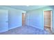 Spacious bedroom with carpet flooring, and access to bathroom and closet at 2123 Cartgate Lane, Winter Haven, FL 33884