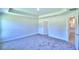 Well-lit bedroom featuring carpet and an ensuite bathroom at 2123 Cartgate Lane, Winter Haven, FL 33884