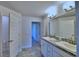 Double vanity bathroom with granite countertop and tile flooring at 2123 Cartgate Lane, Winter Haven, FL 33884