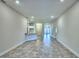 Open living area with tile flooring and neutral tones at 2123 Cartgate Lane, Winter Haven, FL 33884