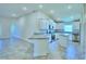 Open concept kitchen with an island and stainless steel appliances at 2123 Cartgate Lane, Winter Haven, FL 33884
