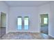 Bright hallway with tile flooring and access to other rooms at 2123 Cartgate Lane, Winter Haven, FL 33884
