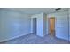 Well-lit bedroom with carpet flooring and access to bath at 2123 Cartgate Lane, Winter Haven, FL 33884