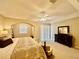 Main bedroom with king-size bed, sitting area, and access to balcony at 1876 Eloise Cove Dr, Winter Haven, FL 33884