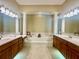 Elegant bathroom with a large soaking tub and double vanities at 1876 Eloise Cove Dr, Winter Haven, FL 33884