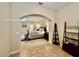 Spacious bedroom with a large bed and access to a bathroom at 1876 Eloise Cove Dr, Winter Haven, FL 33884