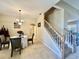 Bright dining room with a view to the staircase and hardwood floors at 1876 Eloise Cove Dr, Winter Haven, FL 33884