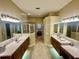 Bathroom with double sinks, a shower, and a separate tub at 1876 Eloise Cove Dr, Winter Haven, FL 33884