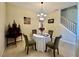 Elegant dining room features a chandelier and seating for four at 1876 Eloise Cove Dr, Winter Haven, FL 33884