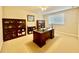 Bright home office features built-in shelving and a large desk at 1876 Eloise Cove Dr, Winter Haven, FL 33884
