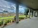Screened porch with view of fenced backyard at 1876 Eloise Cove Dr, Winter Haven, FL 33884