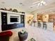 Open-concept Gathering room with views into kitchen and staircase at 1876 Eloise Cove Dr, Winter Haven, FL 33884