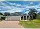 Two-story home with a large driveway and manicured lawn at 1876 Eloise Cove Dr, Winter Haven, FL 33884