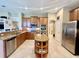 Eat-in kitchen boasts stainless steel appliances and granite countertops at 1876 Eloise Cove Dr, Winter Haven, FL 33884