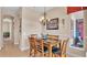 Bright dining room with table and chairs, chandelier, and view to backyard at 318 Crescent Ridge Rd, Auburndale, FL 33823