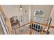 View of the home's entryway, showing the staircase, dining room, and living room at 318 Crescent Ridge Rd, Auburndale, FL 33823