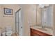 Clean bathroom with a toilet, sink, and shower at 318 Crescent Ridge Rd, Auburndale, FL 33823