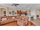 Kitchen with an island, hardwood floors, and a large sectional sofa at 318 Crescent Ridge Rd, Auburndale, FL 33823