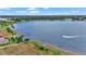 Stunning aerial view showcasing waterfront property and boat at 318 Crescent Ridge Rd, Auburndale, FL 33823