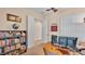 Home office with a desk, bookcase, and view into another room at 318 Crescent Ridge Rd, Auburndale, FL 33823