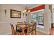Breakfast nook with glass-top table and access to screened patio at 318 Crescent Ridge Rd, Auburndale, FL 33823