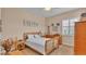 Cozy bedroom with a queen-size bed, nightstand, and dresser at 318 Crescent Ridge Rd, Auburndale, FL 33823