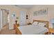 Bedroom with a wooden bed frame, carpeted floors, and nightstands at 318 Crescent Ridge Rd, Auburndale, FL 33823