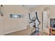 Home gym with an elliptical machine and access to other rooms at 318 Crescent Ridge Rd, Auburndale, FL 33823