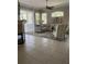 Spacious living room with a fireplace and large windows at 102 Jardin Ln, Winter Haven, FL 33884