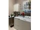 Bright laundry room with washer, dryer, and ample storage at 102 Jardin Ln, Winter Haven, FL 33884