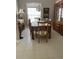 Formal dining room with wood table and hutch at 102 Jardin Ln, Winter Haven, FL 33884
