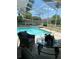 Refreshing screened pool with ample deck space for lounging at 102 Jardin Ln, Winter Haven, FL 33884
