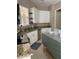 Kitchen with white cabinets, granite countertops and tile floors at 102 Jardin Ln, Winter Haven, FL 33884