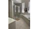 Large bathroom with soaking tub, shower, and updated fixtures at 102 Jardin Ln, Winter Haven, FL 33884